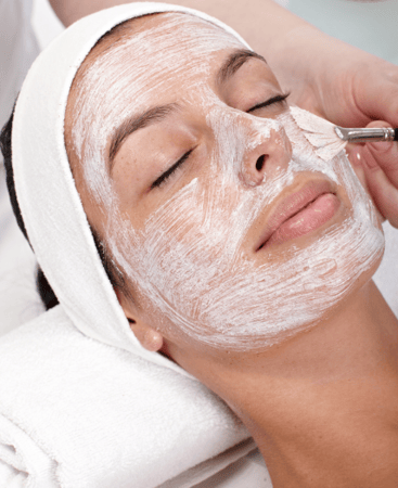 Woman receiving medi-aesthetic facial treatment